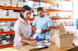 Female manager using tablet computer in a small business